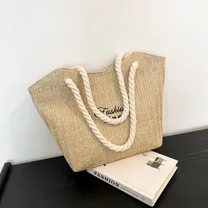 Large beige woven straw tote bag with cotton rope handles and Fashion embroidery