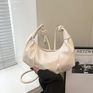 Chic cream white dumpling bag with soft pleated PU leather and woven strap handle