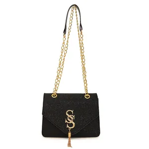 Chic black sequin crossbody bag with gold SSS logo and fringe chain detail