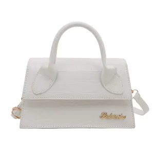 Elegant white crocodile embossed crossbody bag with gold logo and top handle