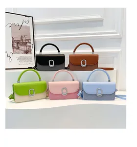Detailed collection of five colored leather handbags on white display steps