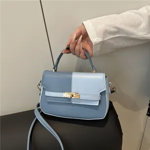 Fashionable blue contrast color saddle bag with metal clasp and top handle for women