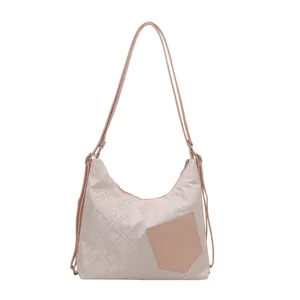 Pink jacquard tote bag featuring traditional floral embroidery and shoulder strap