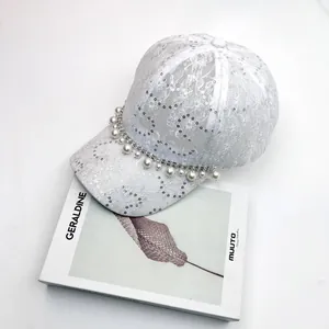 Elegant white lace baseball cap with sparkling sequins, pearls and rhinestone chain trim