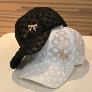Lace baseball cap for women with rhinestone bow accent in black and white colors