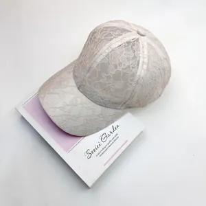 Close-up of beige floral lace texture on the breathable summer baseball cap