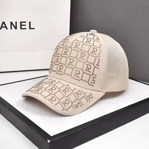 Beige rhinestone baseball cap with letter R pattern and breathable mesh back panel