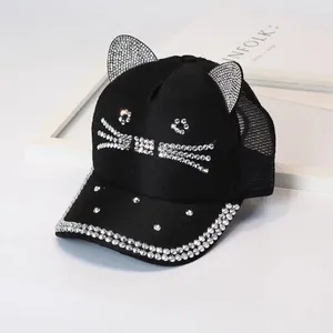 Detailed view of rhinestones on cat ear baseball cap with breathable mesh design