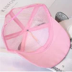 Detailed top view of pink mesh baseball cap interior with breathable fabric and stitching