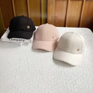Plush wool baseball cap with gold H logo in black, pink, and beige color options