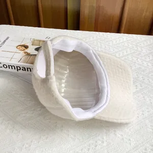 Detailed interior view of a beige wool baseball cap featuring soft lining and inner band