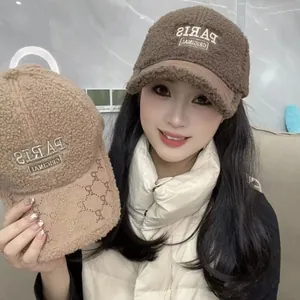 Detail of PARIS embroidery and monogram brim on plush faux shearling baseball caps