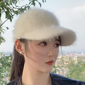 Close-up of white mohair open-top baseball cap texture on female model outdoors