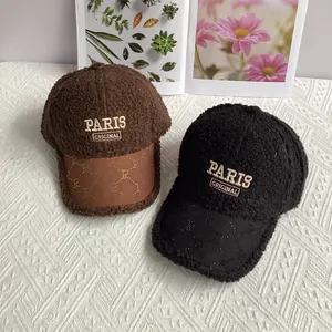 Detail of embroidered PARIS logo on lamb wool baseball cap with textured leather brim