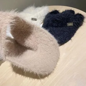 Trio of plush mohair topless hats in cream and black featuring elegant metal labels