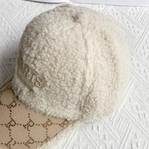 Close-up of Sherpa fleece baseball cap featuring rhinestone R pattern and PARIS embroidery