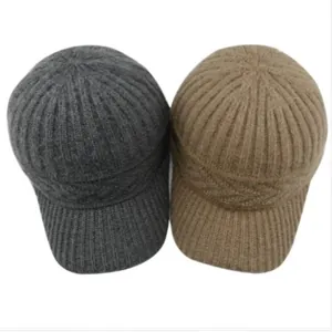 Knit baseball caps in grey and brown showing the vertical stripe texture and visor