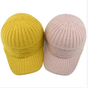 Knitted baseball cap in yellow and pink featuring thick wool texture and cable patterns