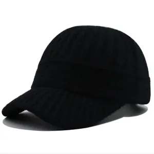 Detail shot of the black knitted baseball cap showing the warm textured ribbed wool material