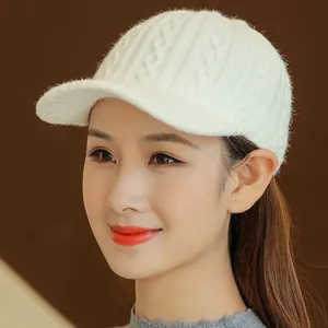 Detailed side view of white cable knit baseball cap for women with textured patterns