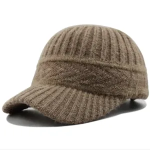 Detailed close-up of dark brown cable knit beanie with brim and ribbed texture fabric