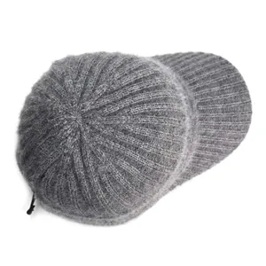 Detailed view of dark grey knitted baseball cap showing fuzzy mohair wool texture