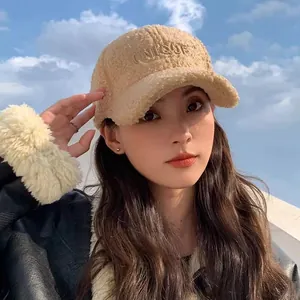 Close-up of UNIQUE embroidery on soft khaki fleece baseball cap for women