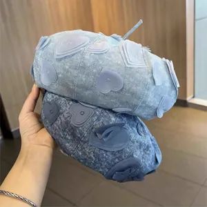Denim beret hat for women with 3D heart appliqués in light and dark blue wash