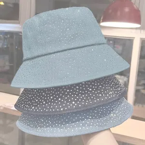 Denim bucket hats for women with sparkling rhinestone embellishments in various blue washes