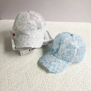 Detailed view of sequins flower embroidery on white and light blue mesh baseball caps