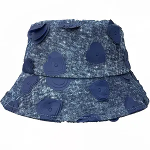 Blue denim bucket hat with 3D heart patches and washed finish for women's outdoor style