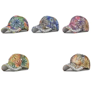Detailed view of fashion baseball caps with floral prints and rhinestone decorations
