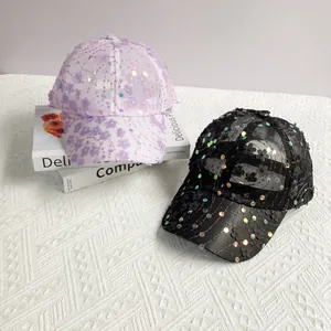 Detail of sequined plum blossom floral embroidery on mesh sunshade baseball cap