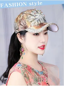Detail of fashion baseball cap with rhinestone maple leaf and pearl brim embroidery