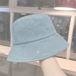 Light blue denim bucket hat with sparkling rhinestones and a trendy flat top design