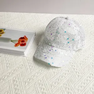 Detail of white mesh baseball cap with silver sequins and 3D floral appliques decoration