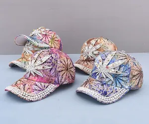 Detail of luxury rhinestone and pearl maple leaf embroidery on floral baseball caps