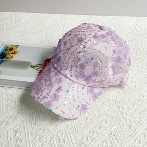 Detailed close-up of purple mesh baseball cap with floral 3D petals and sequins decor