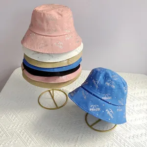 Close-up of rhinestone PRANK lettering on assorted cotton bucket hats for women