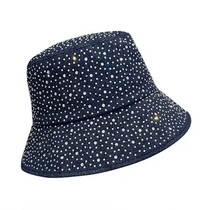 Deep blue denim bucket hat with all-over shimmering rhinestones for a trendy look