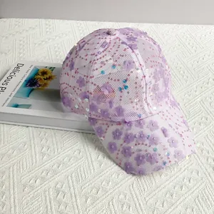 Detail of purple breathable mesh baseball cap with sequined wave patterns and floral appliques