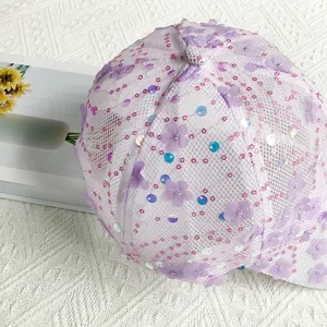 Detail of lavender baseball cap with mesh fabric, 3D floral accents and shiny sequins
