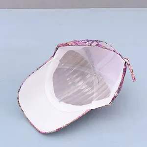 Detailed interior of a purple floral baseball cap showing high-quality white lining