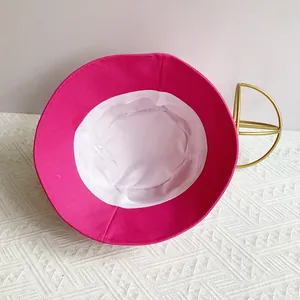Internal structure of a wide brim magenta canvas bucket hat with white lining