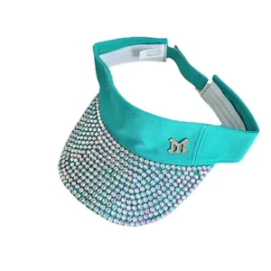 Turquoise sun visor with rhinestones and silver M logo made of 100% polyester