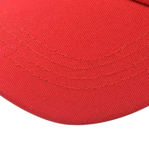 Macro detail of the red cotton twill brim showing precise triple-stitched sewing lines