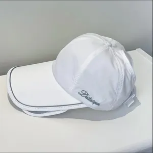 Detail of white quick-dry sun hat with reflective brim and adjustable strap for women