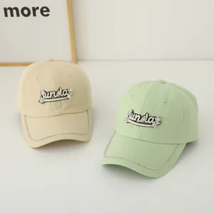 Women's baseball caps in beige and mint green with Sunday embroidery and rhinestones