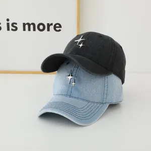 Denim baseball caps in black and light blue with metallic star stud details