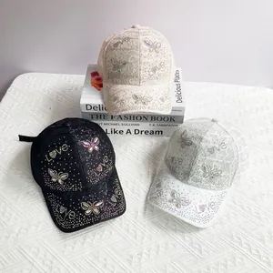Detail of lace baseball caps with rhinestone butterfly and Love motif in three colors